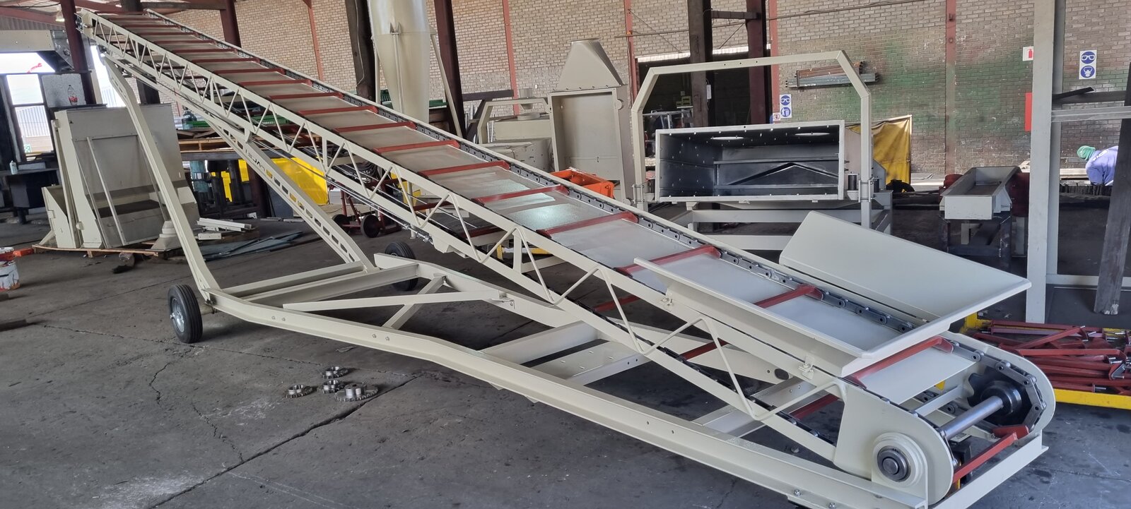 Mobile bag stacker loading a container
