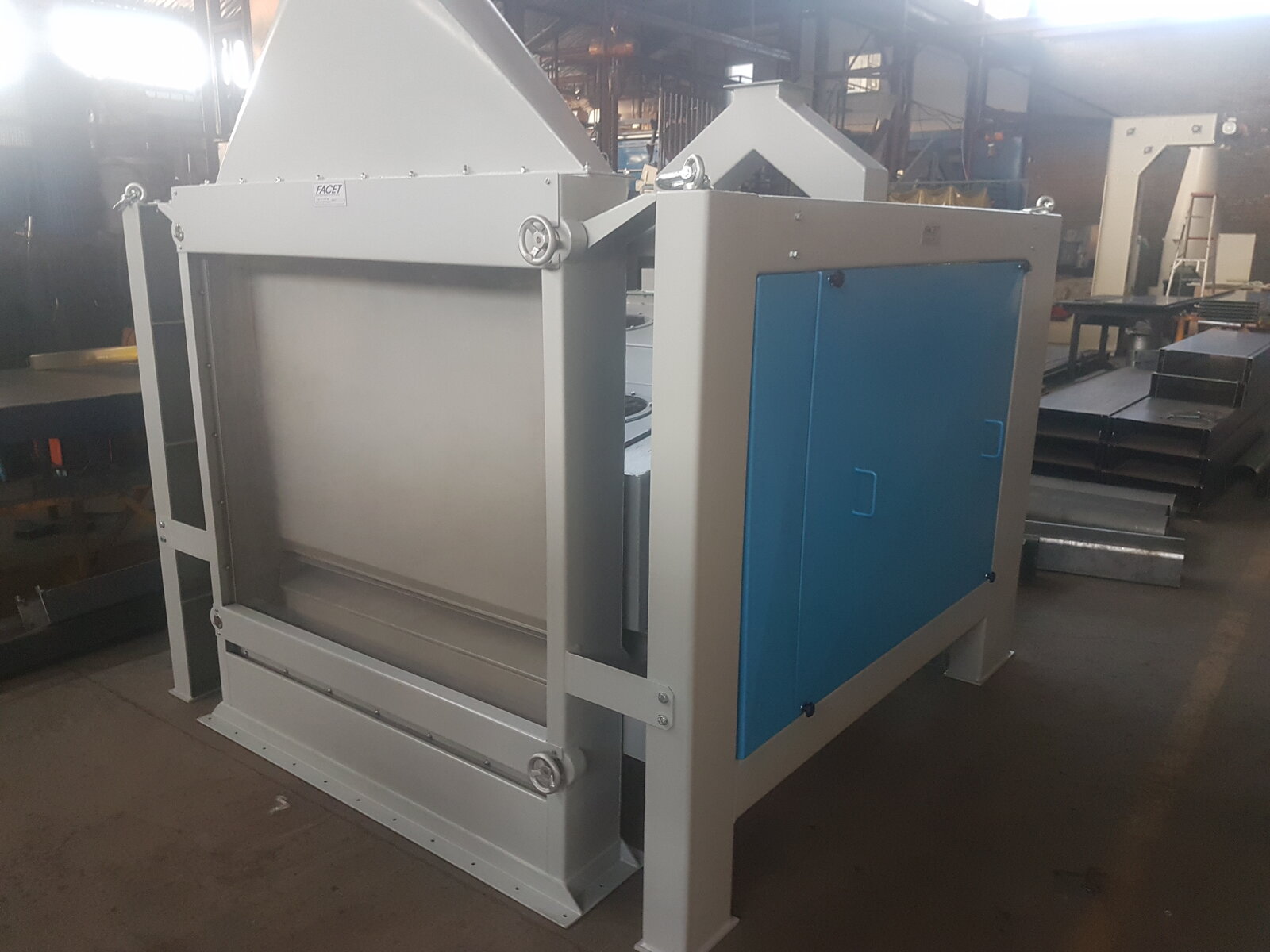 Grain cleaner at full capacity by Facet Engineering