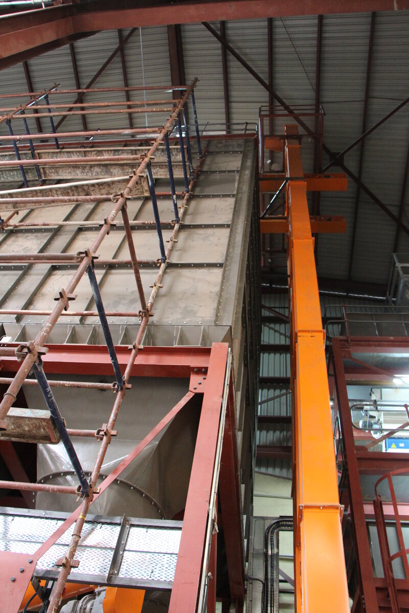 Bolted storage bins with bucket elevator by Facet Engineering