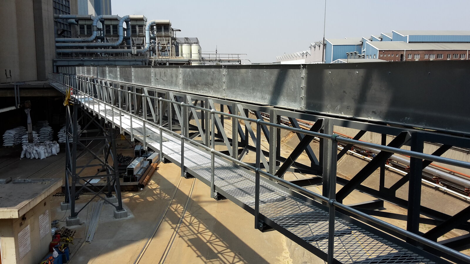Chain conveyor over a plant gantry by Facet Engineering