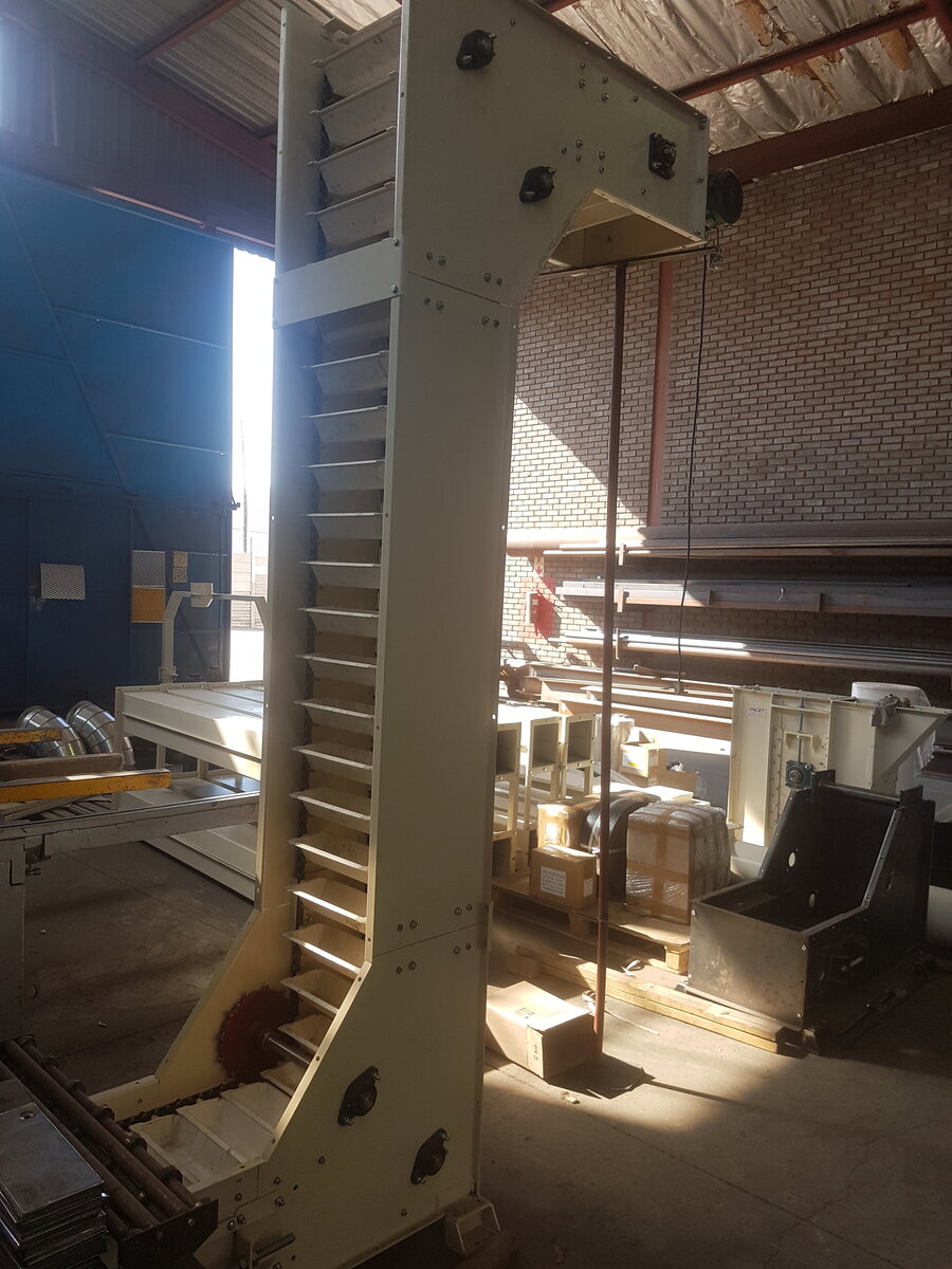 Swing tray bucket elevator installation by Facet Engineering